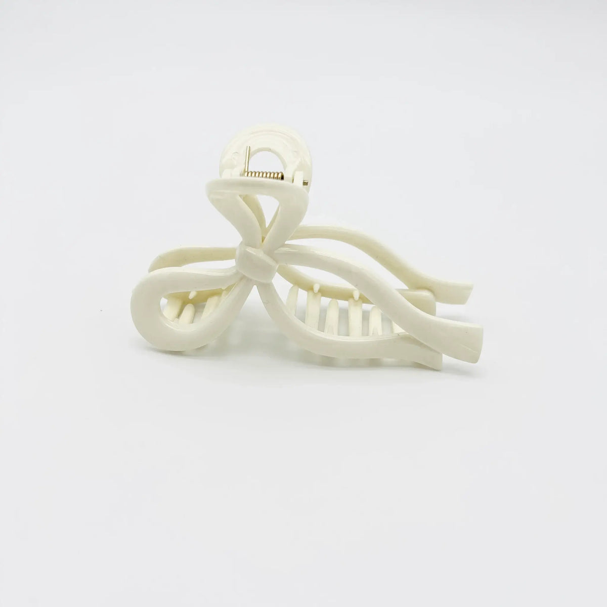 Complete your look with our stylish white bow hair clip accessory.