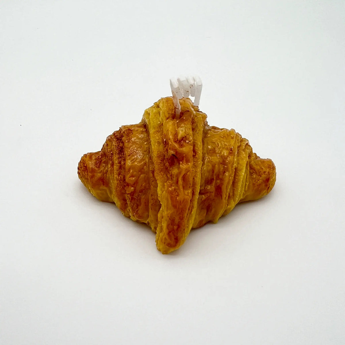 Aromatic candle with the scent of freshly baked croissants