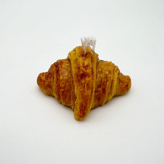 Aromatic candle with the scent of freshly baked croissants