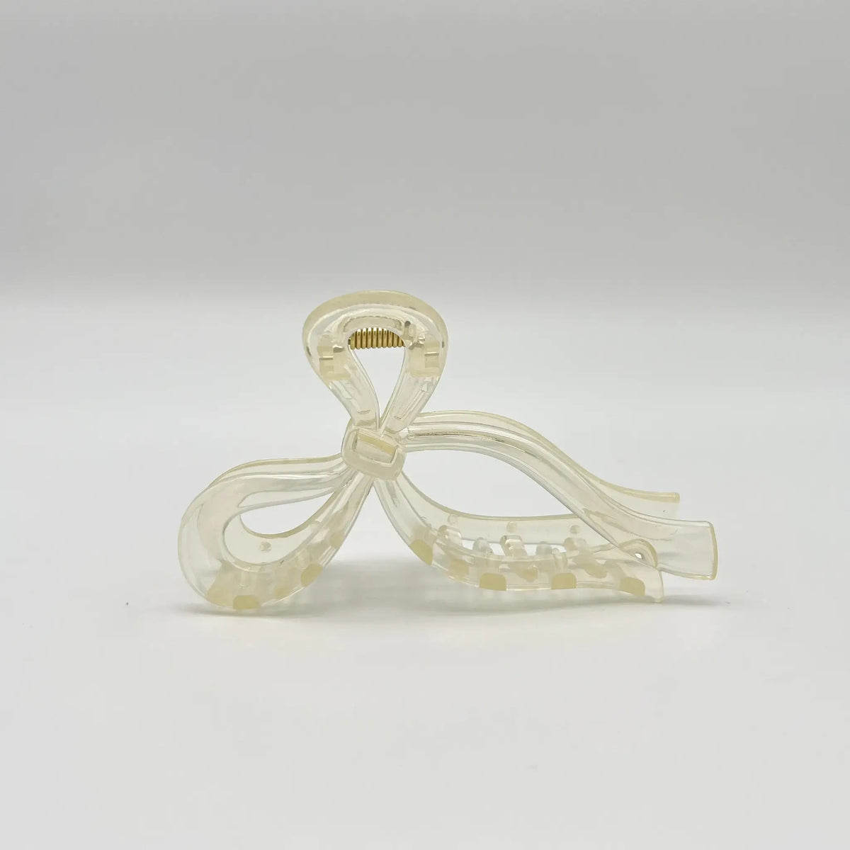 Elegant beige bow clip for any occasion