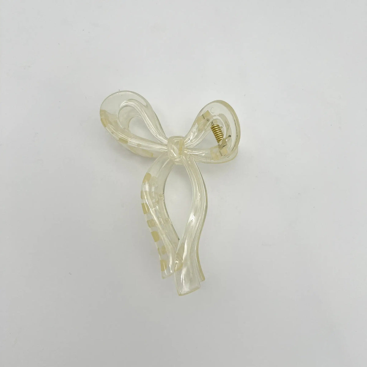 Versatile beige bow clip complements any outfit