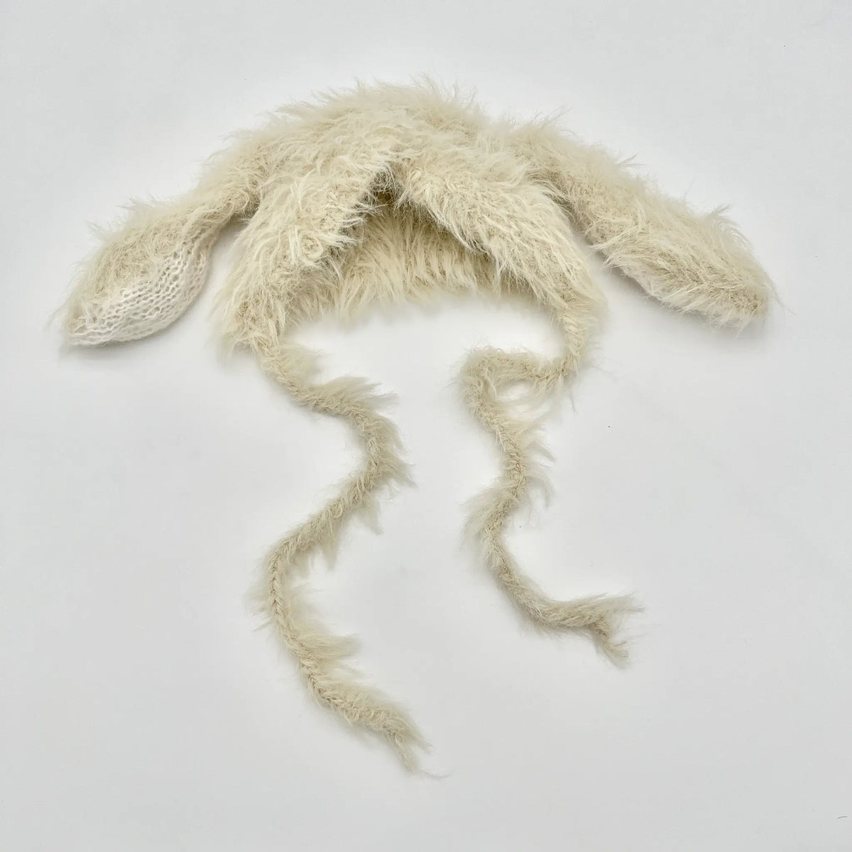 Beige bunny ear hat adds cuteness to baby outfits