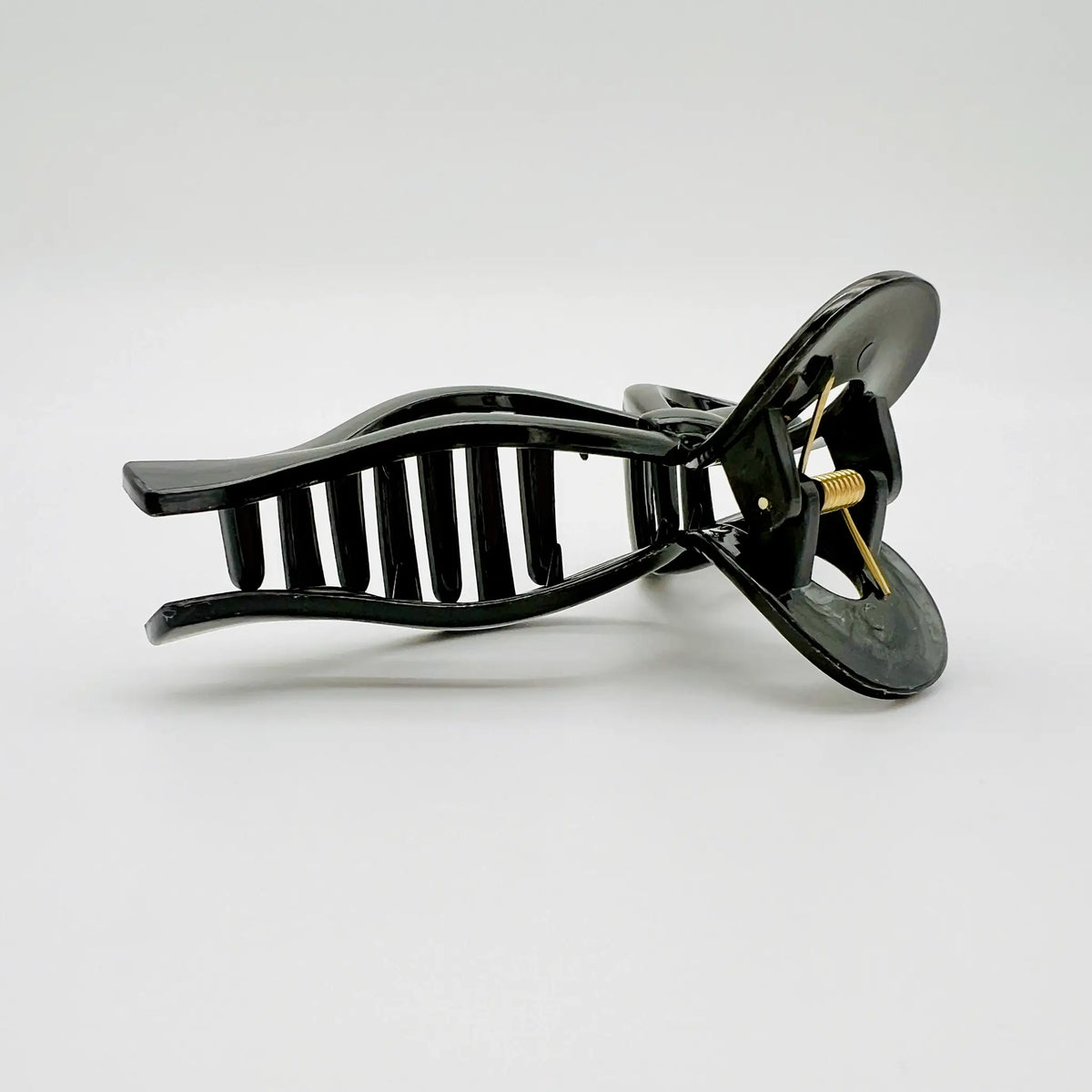 Complete your look with our black bow shaped hair clip