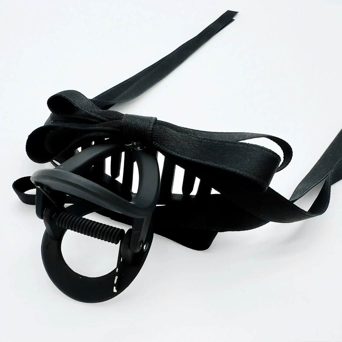 Elegant black ribbon bow hair claw for sophisticated styling
