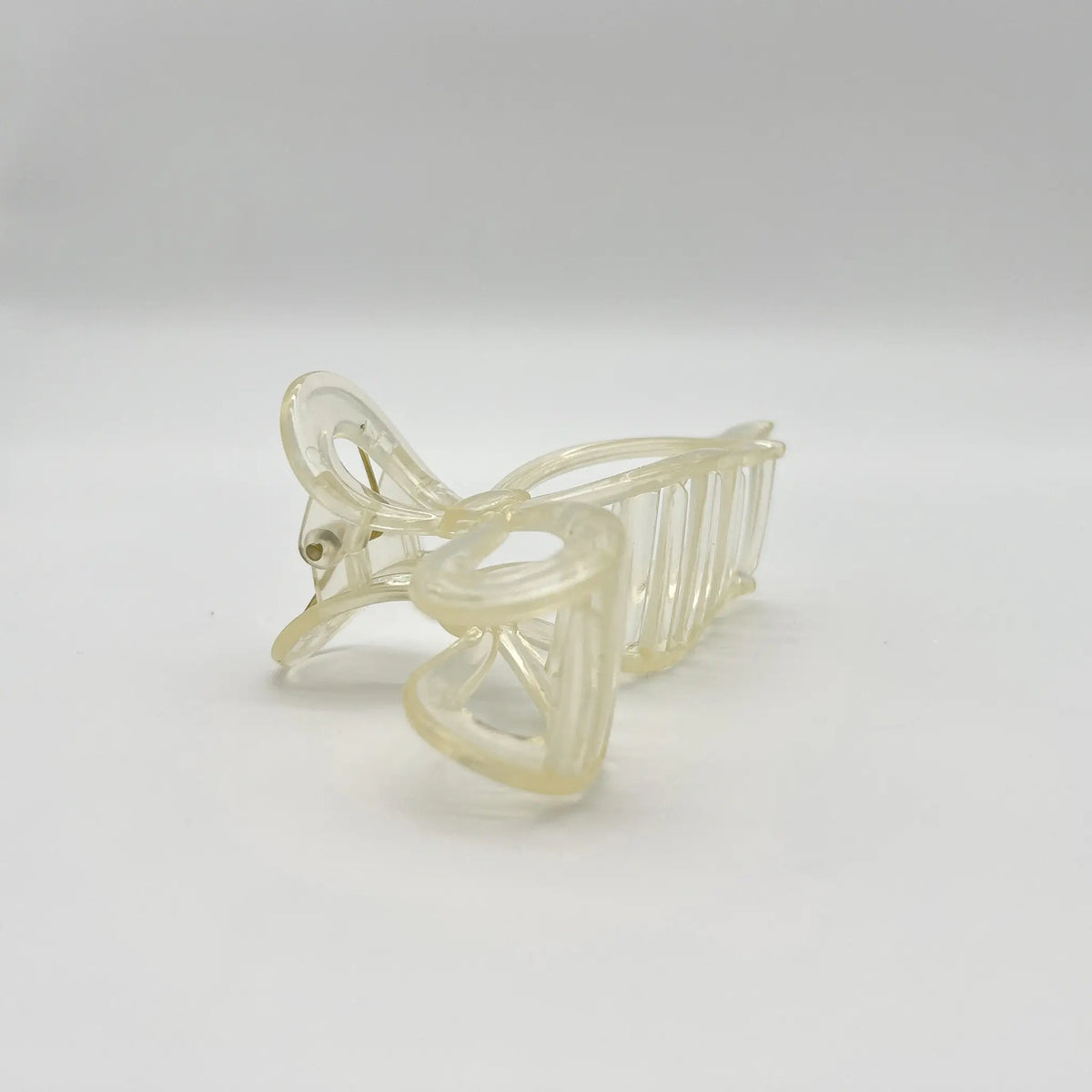 Charming beige bow hair clip adds a touch of class