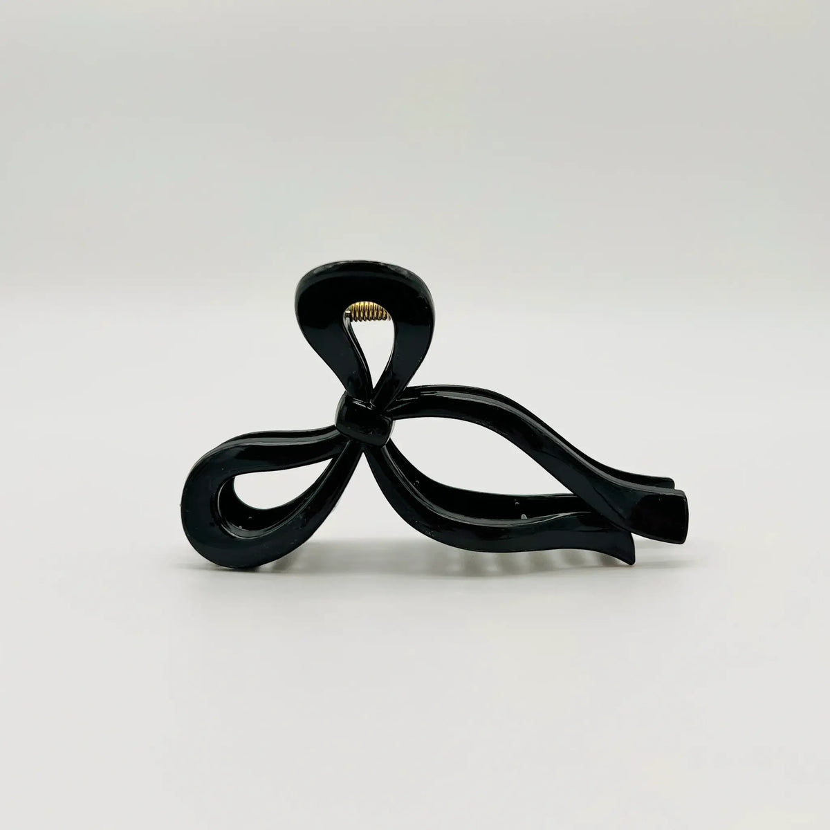 Effortlessly chic with our black bow clip
