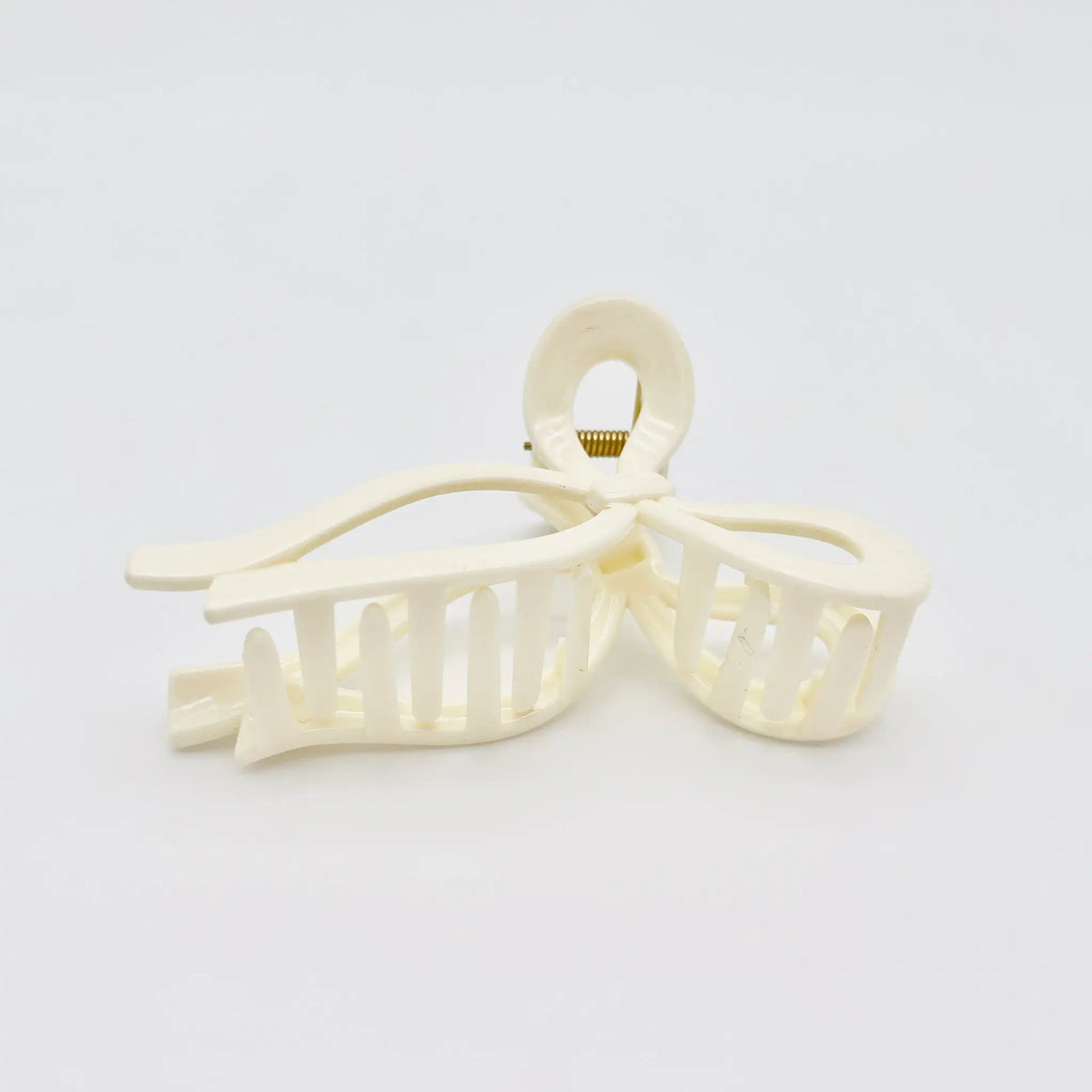 Accessorize elegantly with our white bow hair clip.