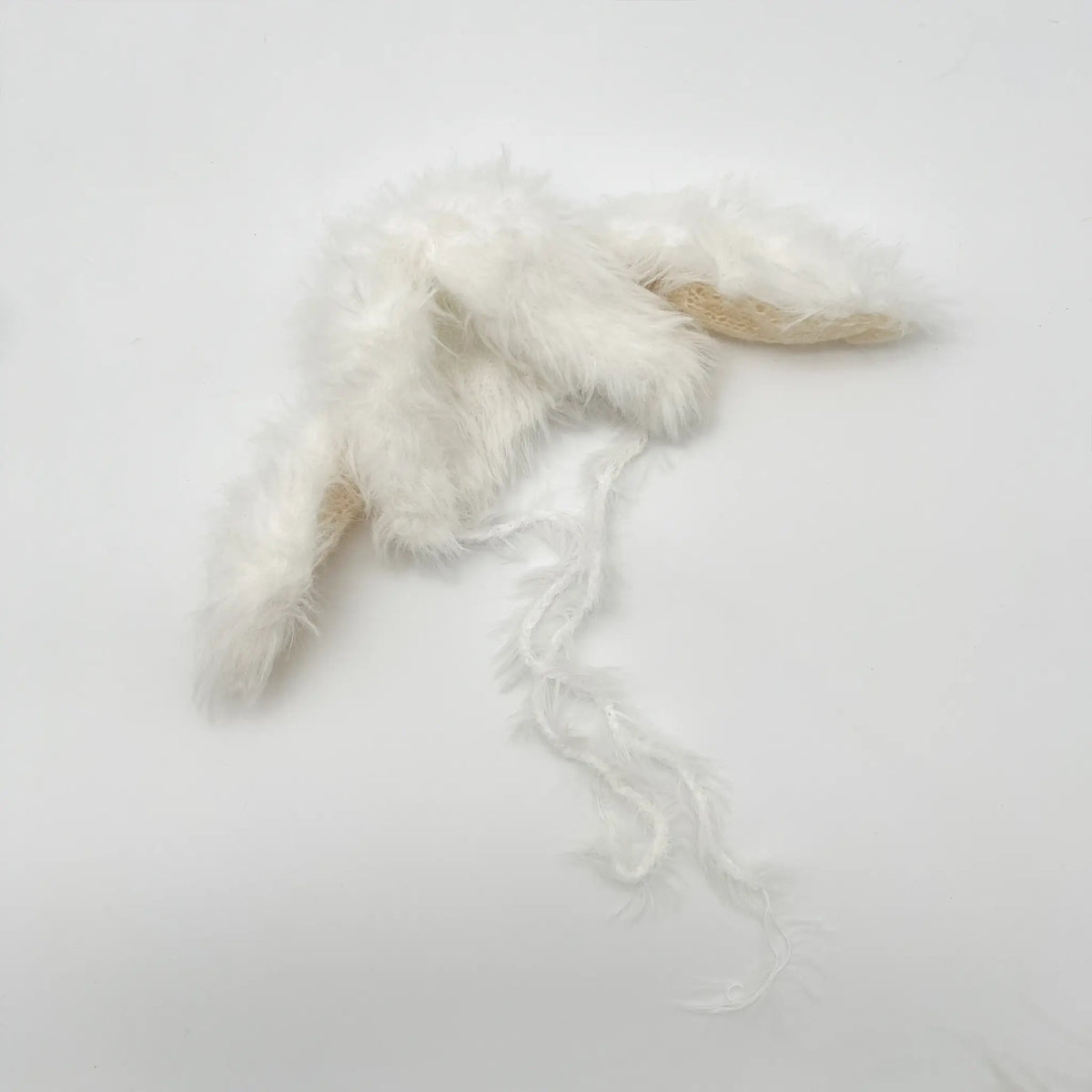 White bunny ear long-haired baby hat for adorable Easter vibes
