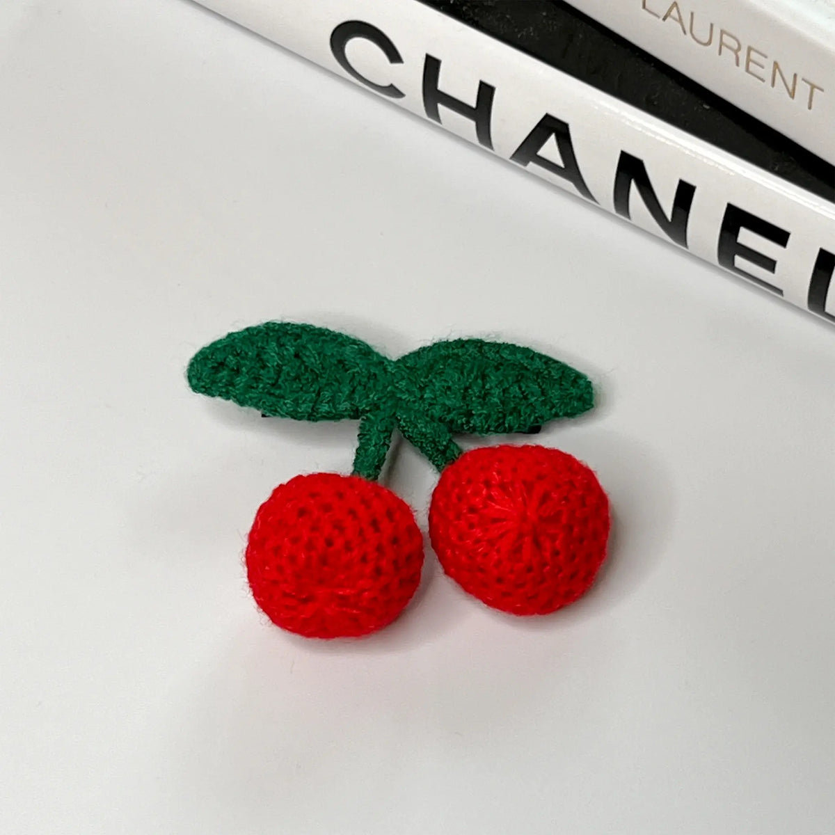 Adorable cherry-themed crochet hair accessories, perfect for a sweet look