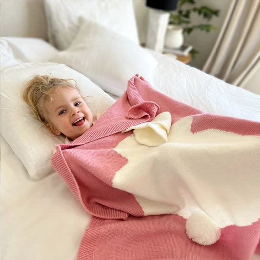 Embrace warmth and comfort with our cozy pink knit bunny blanket
