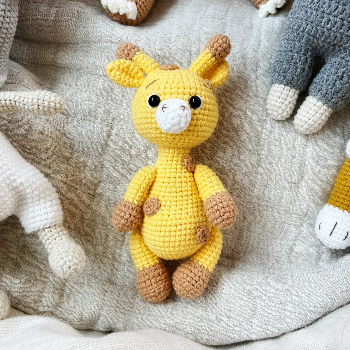 Crocheted giraffe plushie in yellow and brown