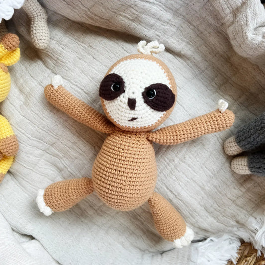 Crocheted sloth stuffed animal for snuggles