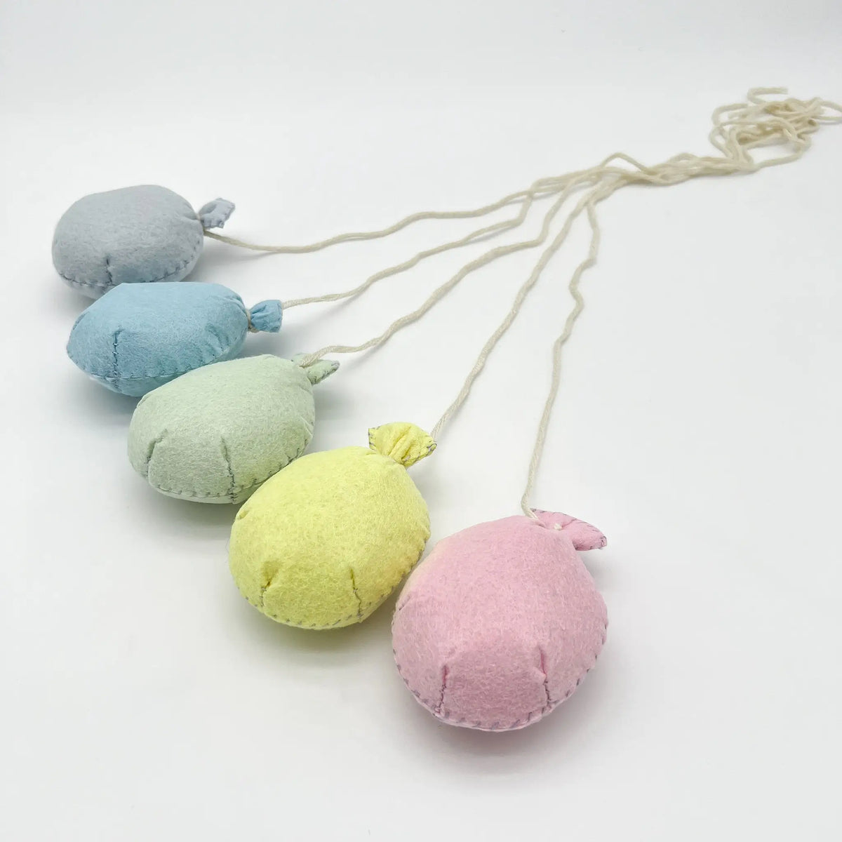 Handcrafted felt balloons adds charm to any photo