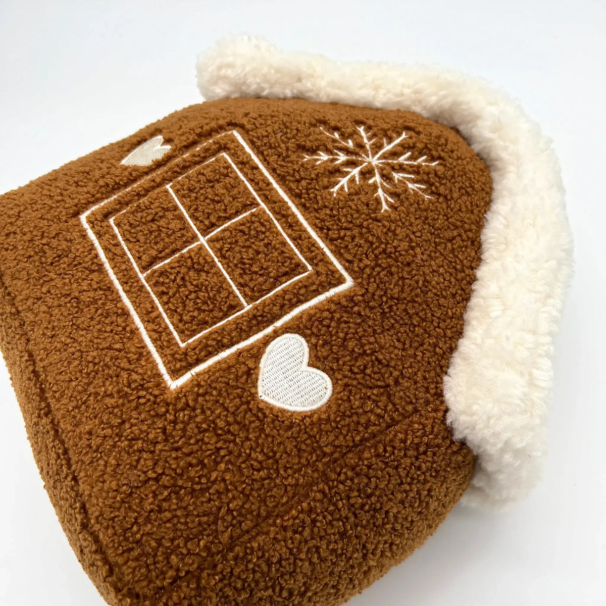 Festive gingerbread house shaped pillow for Christmas decor