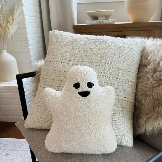 Girl sherpa ghost pillow on couch