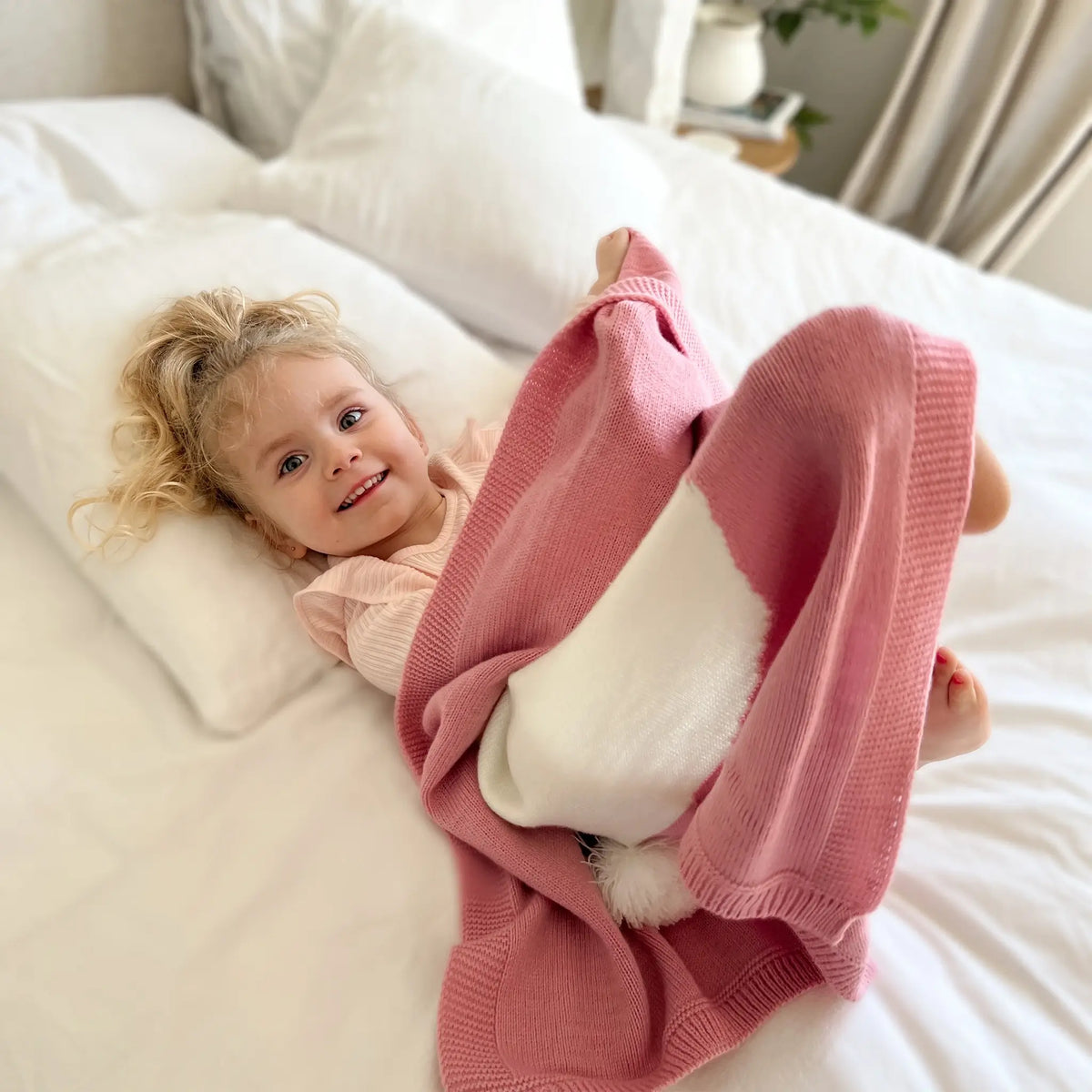 Elevate yourself in luxury with our pink knit bunny blanket