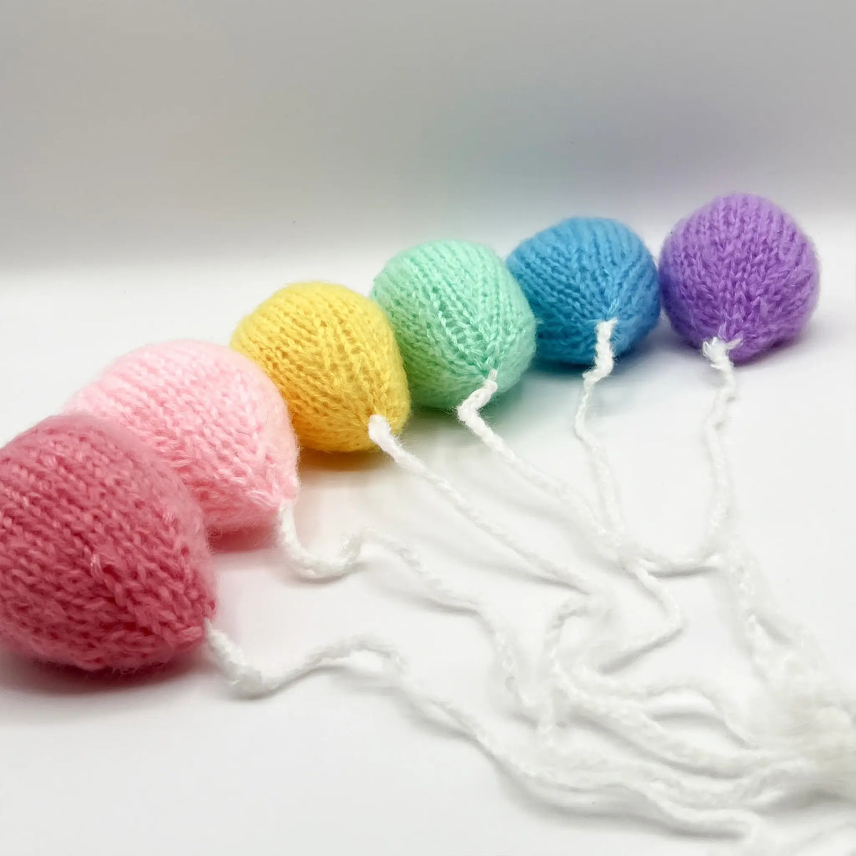 Colorful knit rainbow balloon photography prop for charming photos