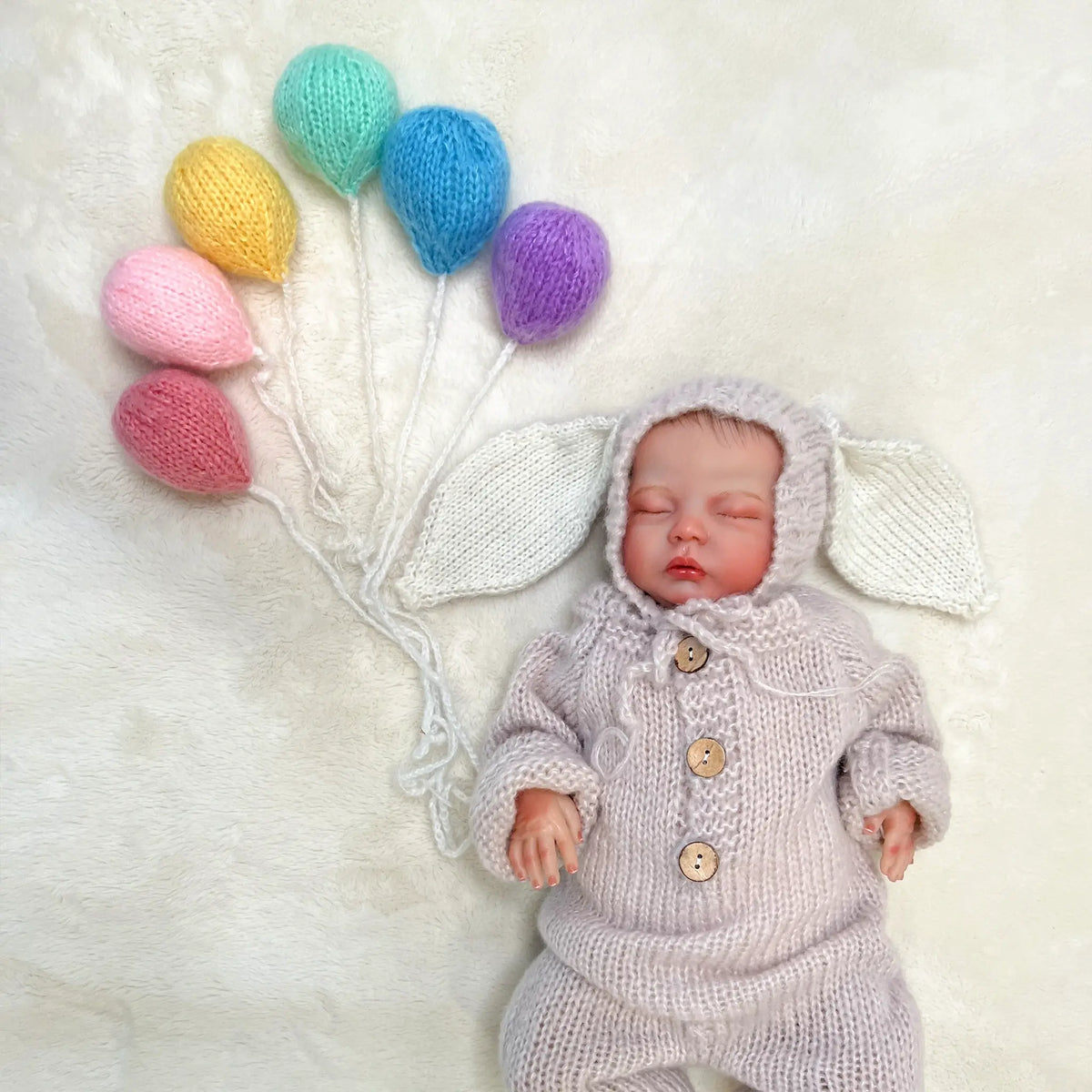 Handmade knit rainbow balloon prop, perfect for newborn photography sessions