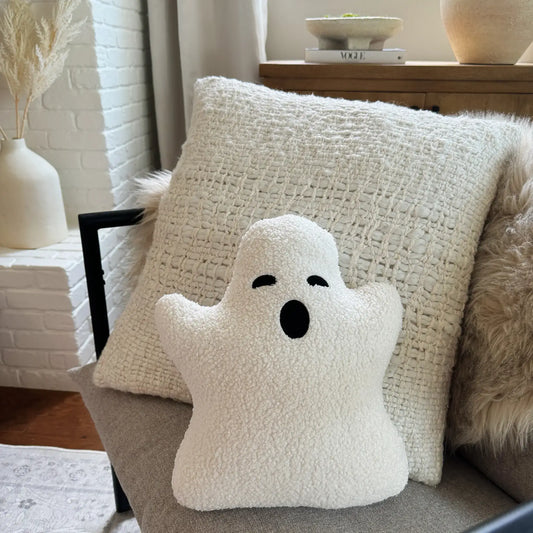 Holiday ghost white sherpa pillow on couch