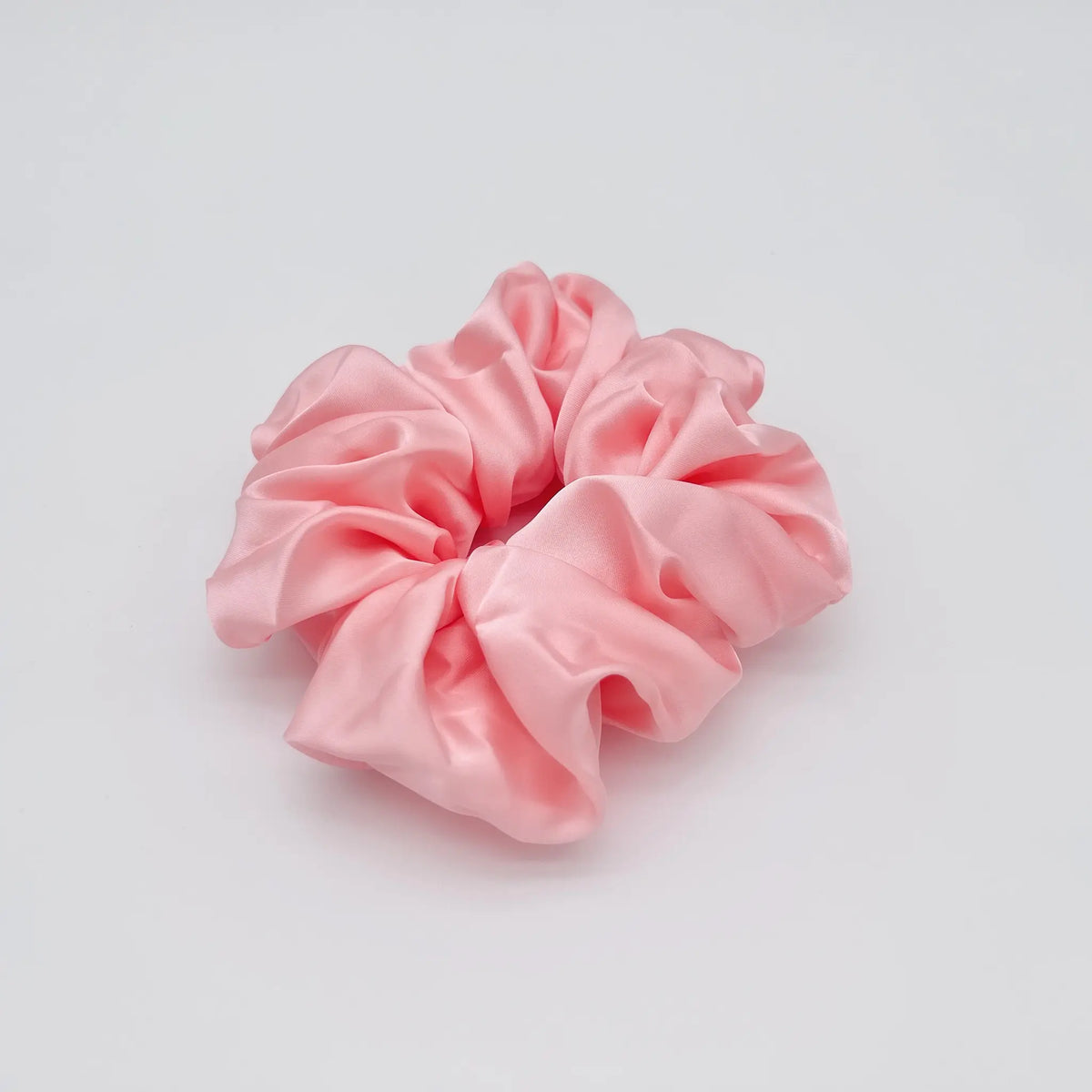 Large pink scrunchie for a bold hair statement
