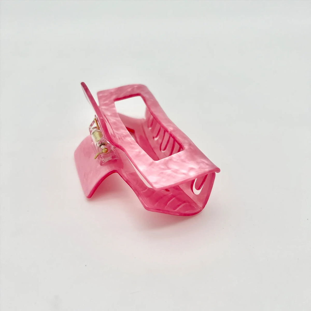 Classic pearly pink clip to elevate any hairstyle