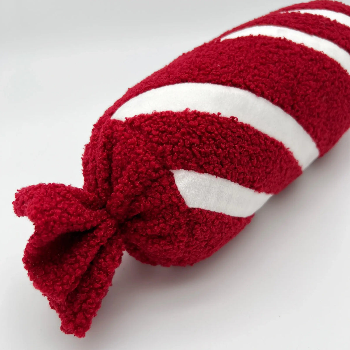 Festive peppermint twist Christmas pillow for holiday cheer