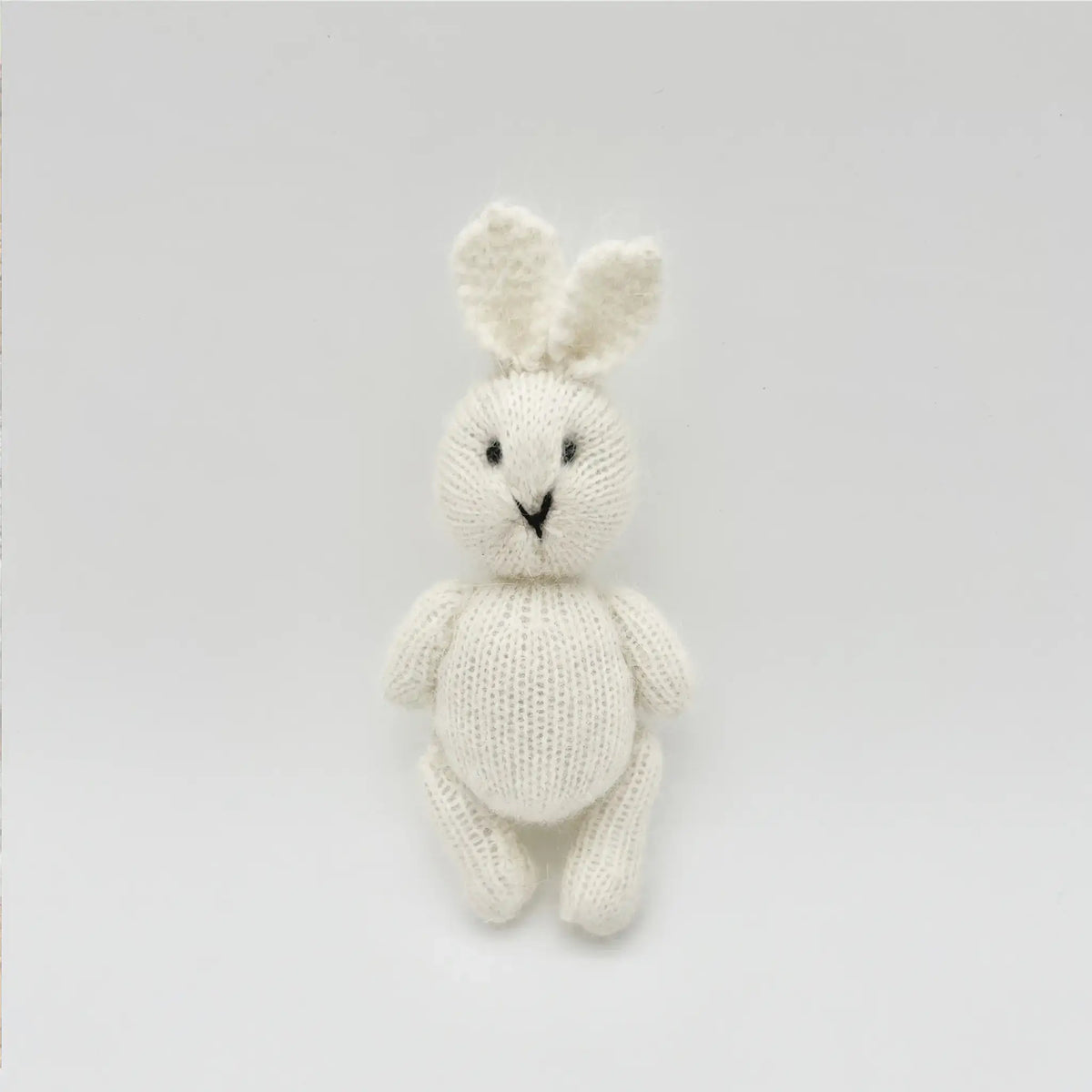 Petite white bunny crafted from soft, natural mohair