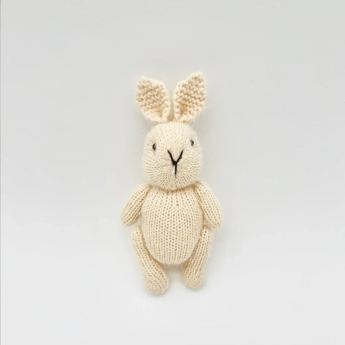 Adorable petite bunny crafted from natural colored mohair