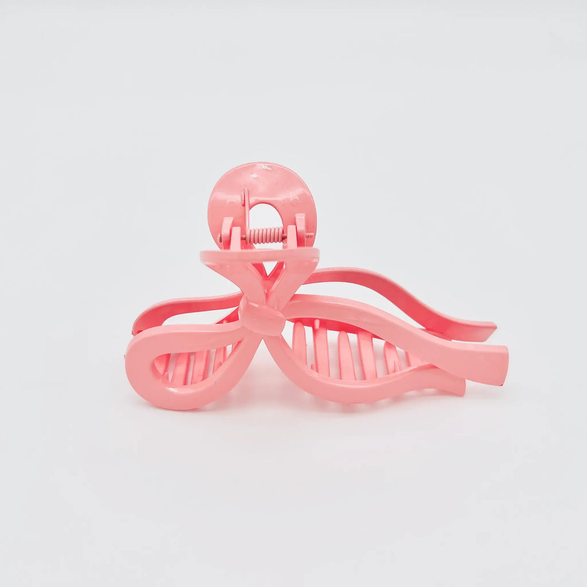 Cute pink bow shaped clip for trendy looks