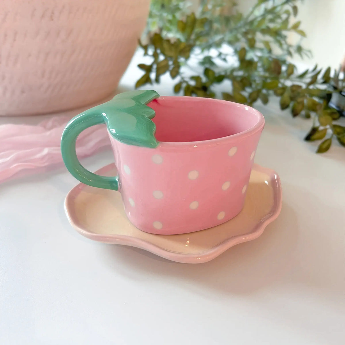 Adorable pink strawberry cup and saucer set for your favorite beverages
