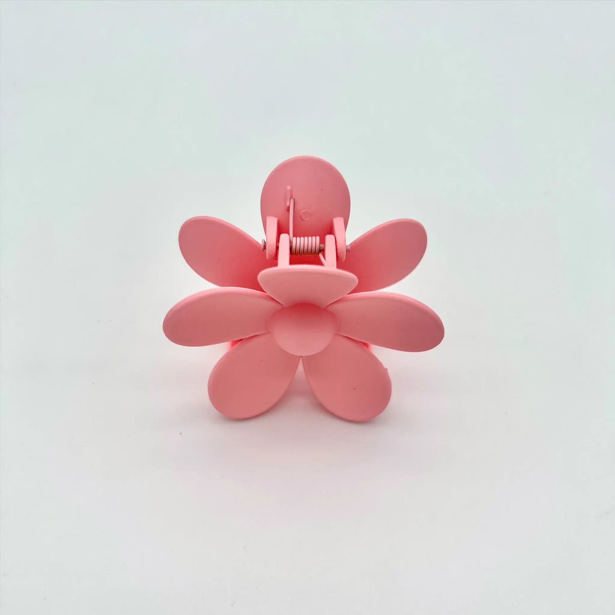 Accessorize with charm using our pink flower hair clip accessory