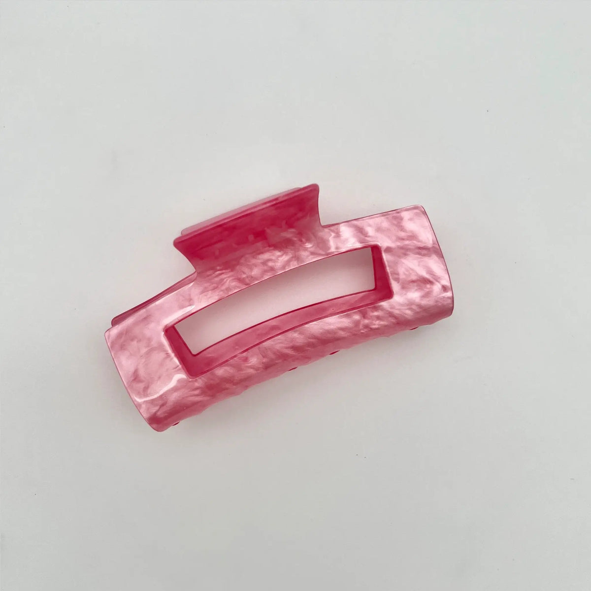 Add a hint of glamour with our pearly pink hair clip accessory