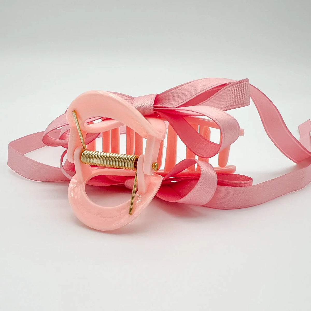 Charming ribbon bow hair clip in soft pink
