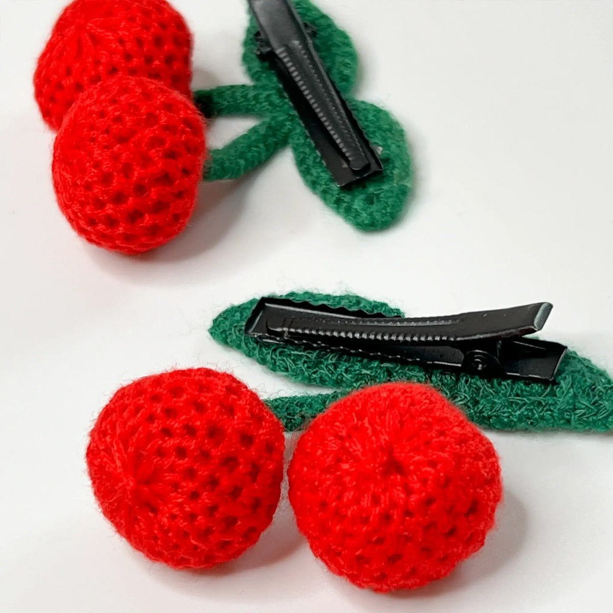 Cute cherry crochet hair clips, perfect for adding a touch of fruity flair