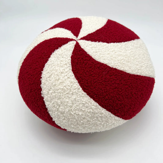 Decorative pillow shaped like a festive round peppermint