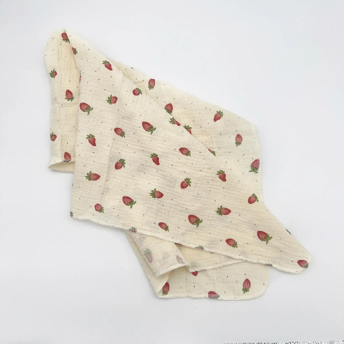Soft muslin swaddle blanket with charming strawberry print
