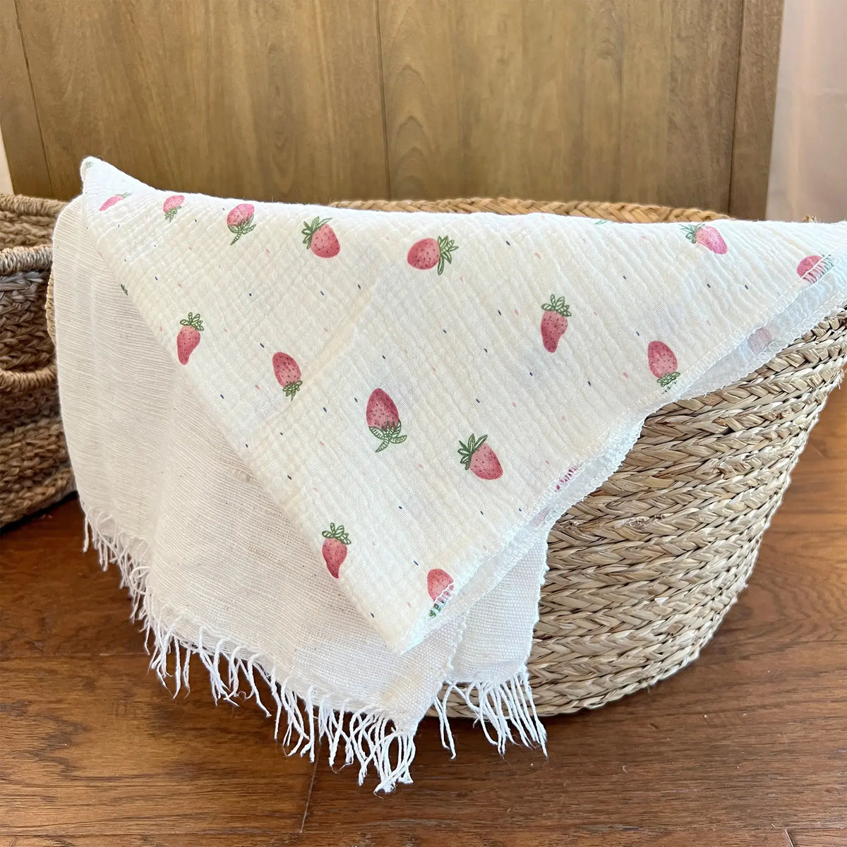 Soft and breathable muslin swaddle with cute strawberries