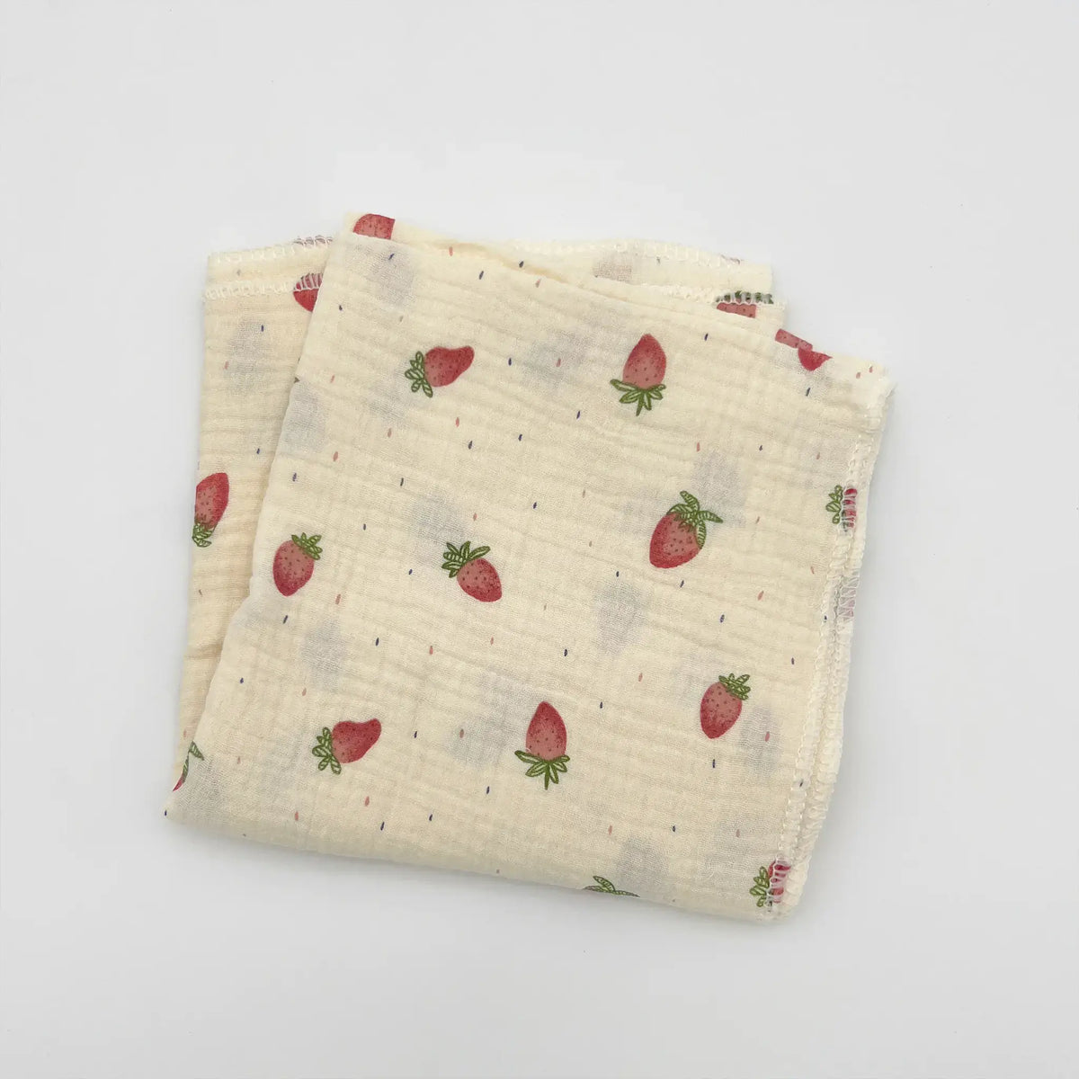 Pink baby swaddle featuring delightful strawberry design