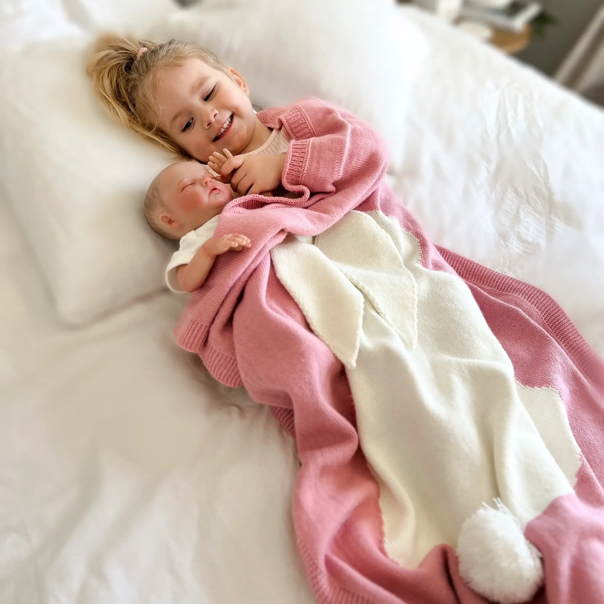 Get cozy with our pink knit bunny blanket. Soft, snug, and irresistibly cute for enhancing your relaxation experience