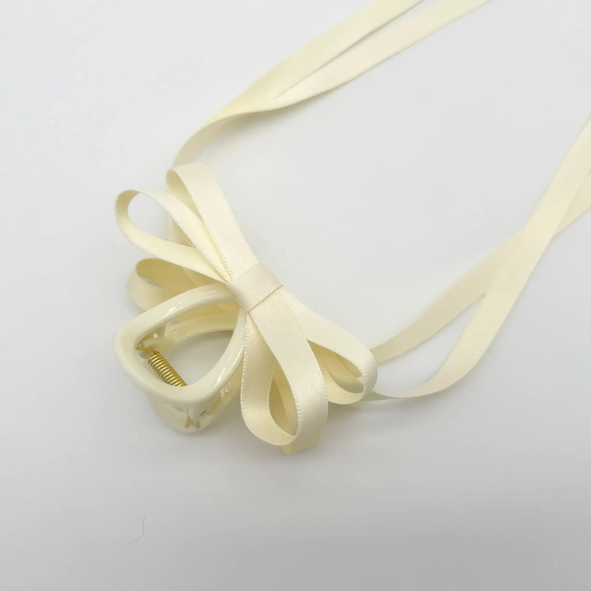 Classic white ribbon bow hair claw for a sophisticated look