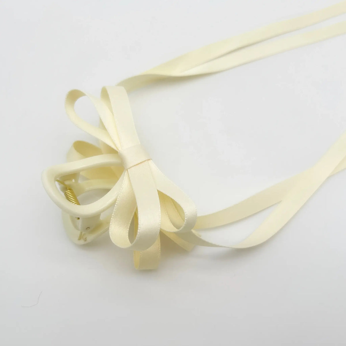 Delicate white ribbon bow hair claw for elegance