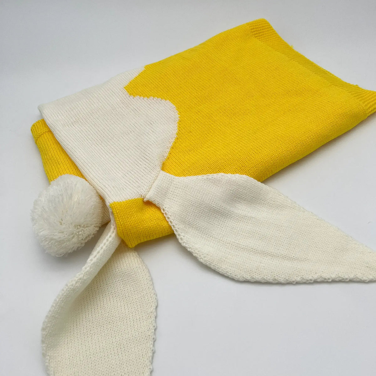 Soft and cozy yellow knit bunny blanket for cuddling